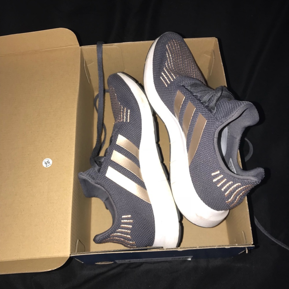 Gray Adidas Swift Run tennis shoes